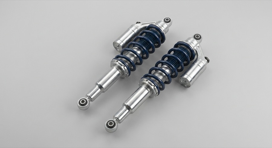 Shock absorbers and struts